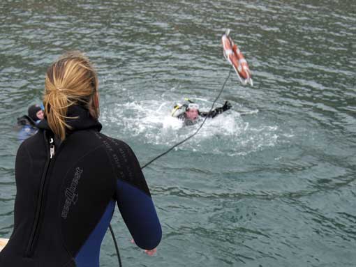 PADI Rescue Diver Course Student throwing a line