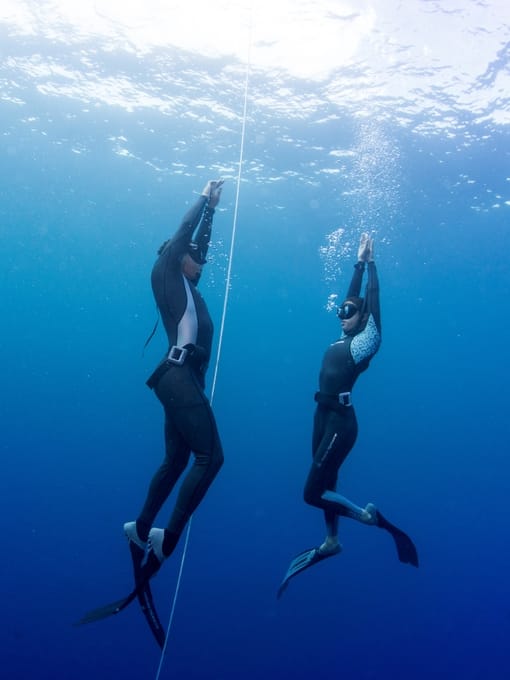 Two Freedivers Ascending