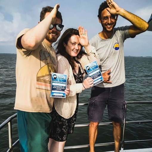 Divers receiving their Shark Guardian Diver Certificates of Completion